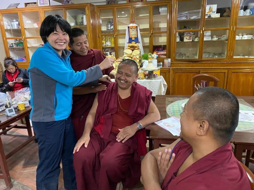Segyu Medical team caring for a senior monk at Segyu Gaden Phodrang Monastery